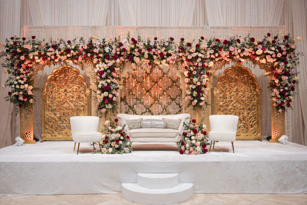 Flower backdrop setup in the grand ballroom of the Bellevue during a Walima